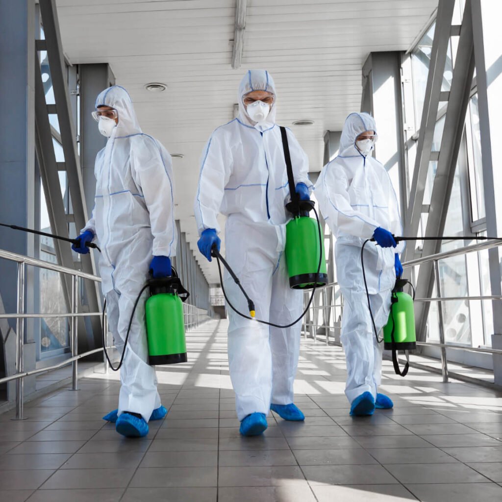 Men In A Protective Suit And Mask Disinfecting Tun 8AXRUSX 1 1024x1024